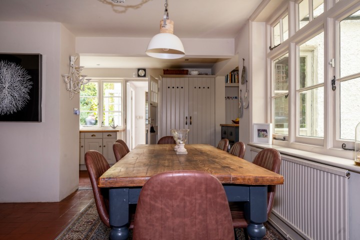 Large farmhouse wooden table in a cottage kitchen